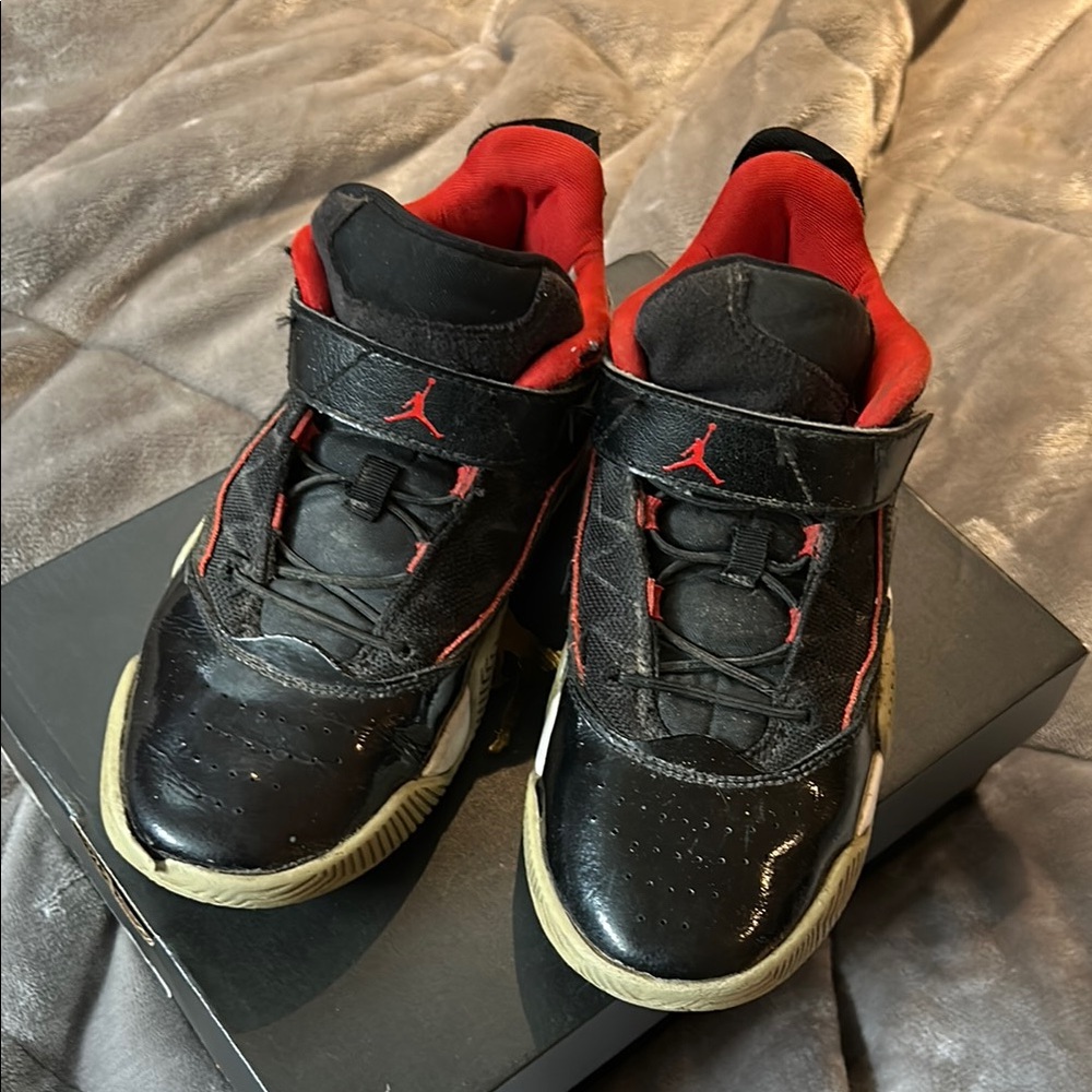 Kids Jordan Black and Red Sneakers